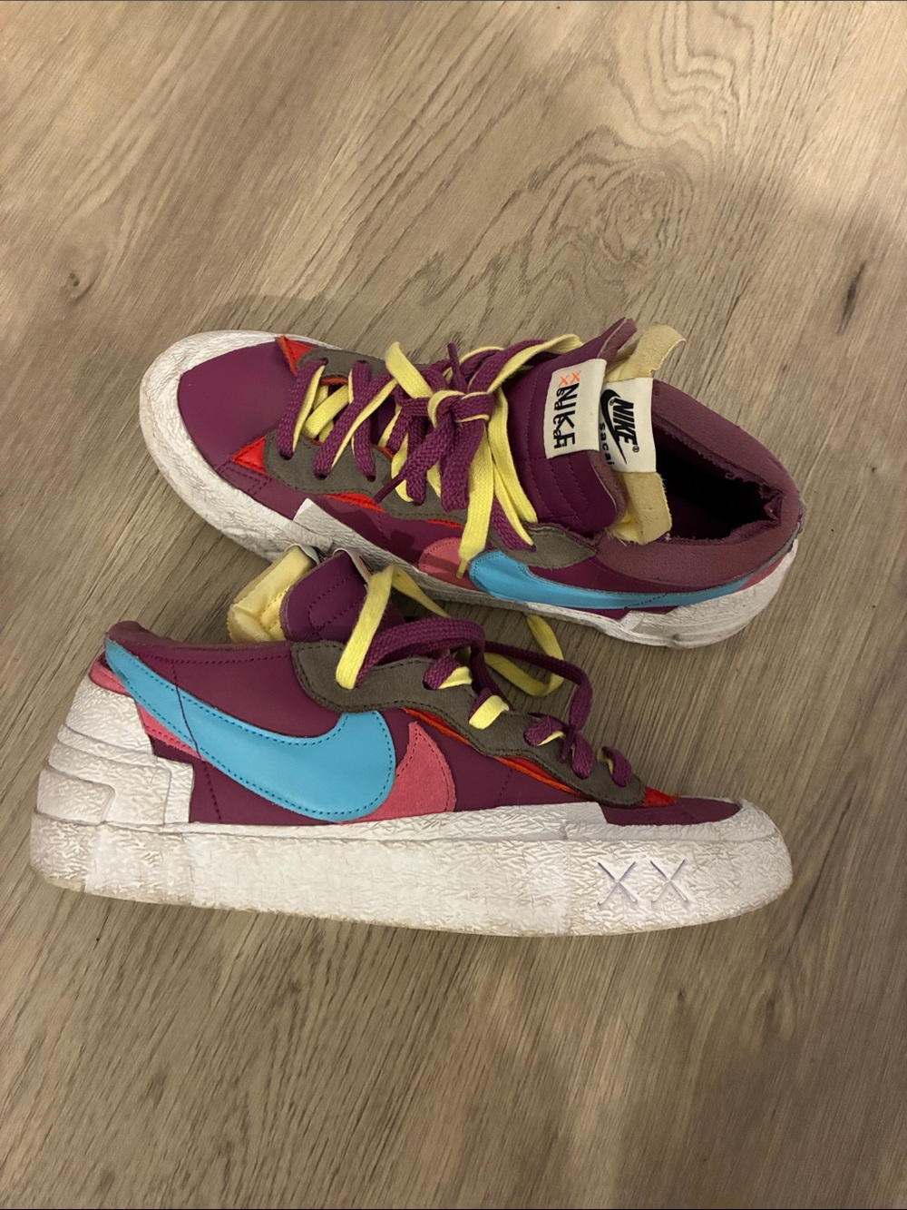 Nike Burgundy Low-Top Sneakers with Blue Swoosh and Yellow Laces